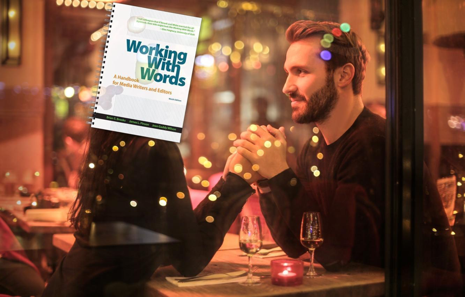 Playful image of person at restaurant with Working With Words handbook.