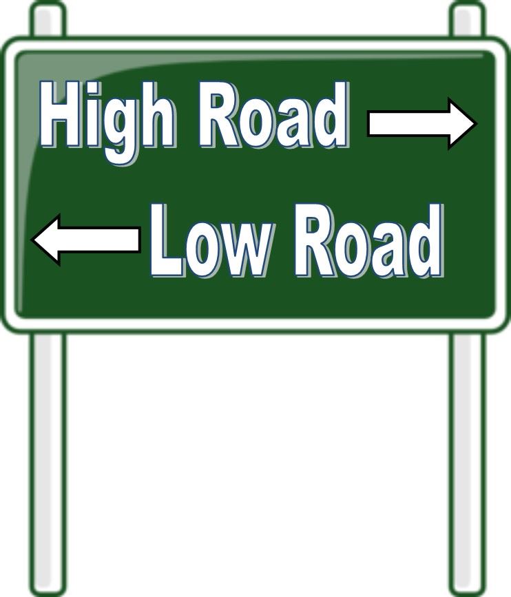 Green highway sign with “High Road” going one way and “Low Road” going the other.