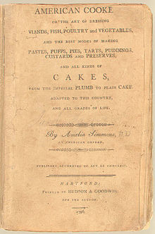 Image is the cover of "American Cookery." It is yellowed and weathered looking, with only traditional typewriter text.